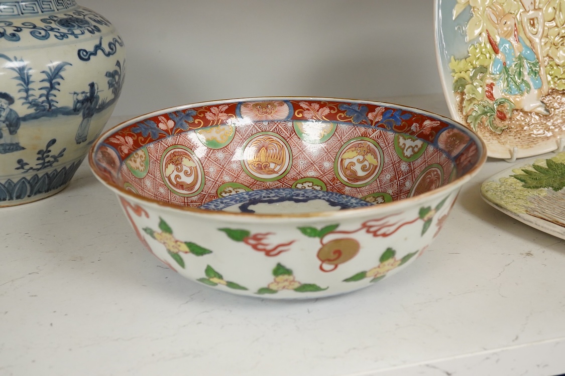 A pair of Chinese blue and white pear shaped vases, a similar jar and a Japanese bowl, largest 23cm in diameter